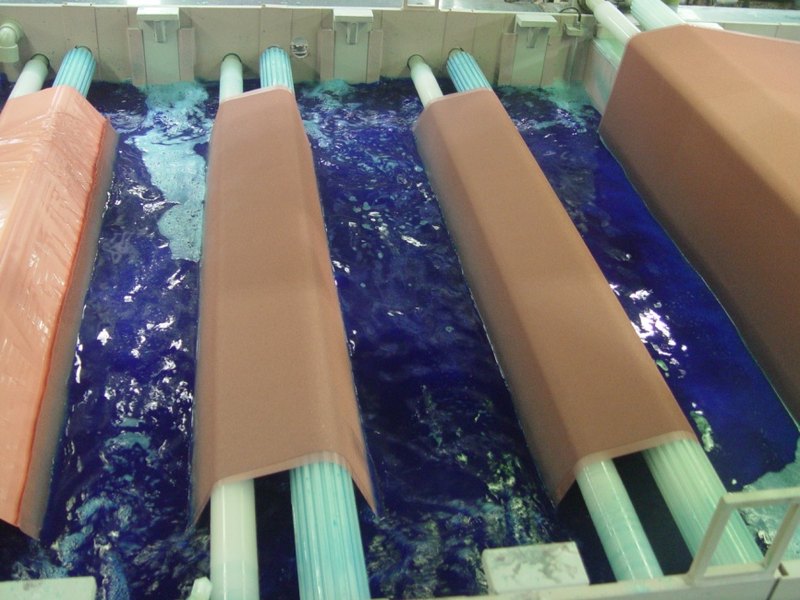 Fabric passing through the copper sulfate plating bath